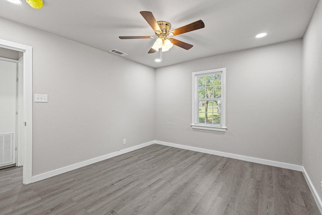 611 S Magnolia St, Pottsboro, TX 75076 - unfurnished room featuring wood finished floors, ceiling fan, baseboards, and recessed lighting
