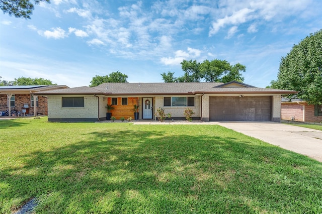 502 E Alexander Ln, Euless, TX 76040 - ranch-style house featuring a garage, concrete driveway, brick siding, and a front yard