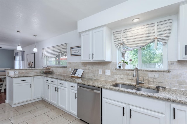 502 E Alexander Ln, Euless, TX 76040 - kitchen featuring dishwasher, a sink, a peninsula, and white cabinets