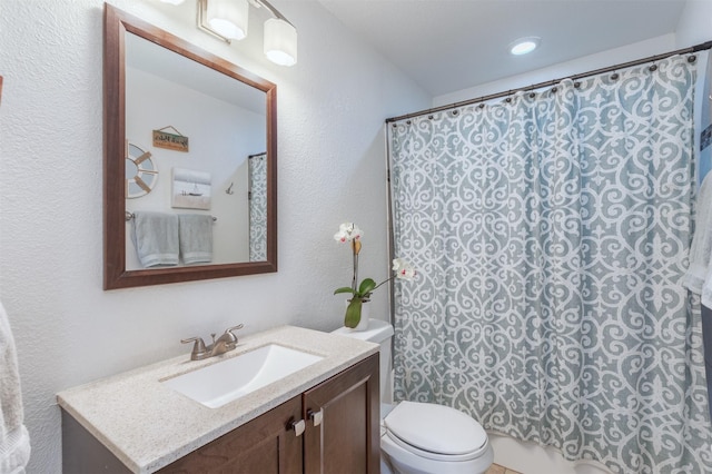 502 E Alexander Ln, Euless, TX 76040 - bathroom with vanity, toilet, a textured wall, and a shower with shower curtain