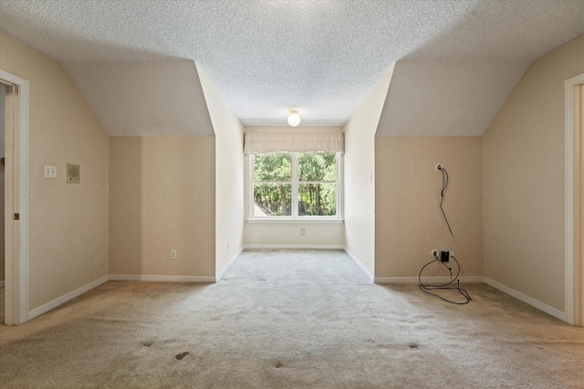 29 Timbergreen Cir, Denton, TX 76205 - bonus room featuring carpet flooring, a textured ceiling, lofted ceiling, and baseboards