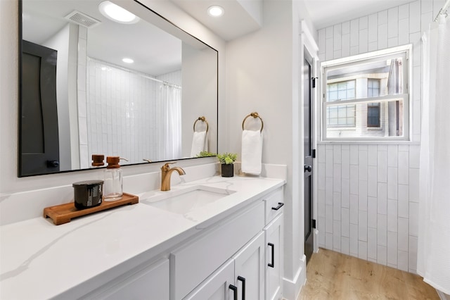 6713 Genoa Rd, Fort Worth, TX 76116 - bathroom with vanity, wood finished floors, and a shower with curtain
