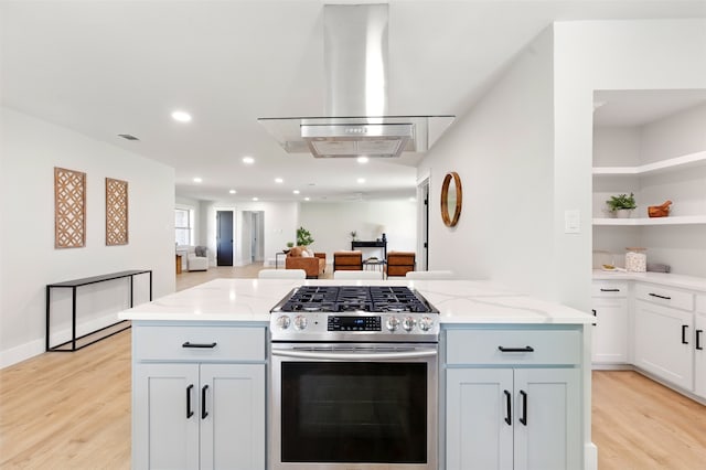 6713 Genoa Rd, Fort Worth, TX 76116 - kitchen with gas stove, exhaust hood, light wood finished floors, light stone counters, and recessed lighting