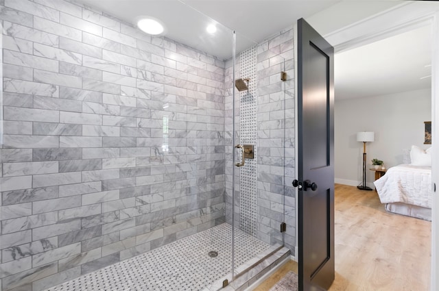 6713 Genoa Rd, Fort Worth, TX 76116 - bathroom with a shower stall, connected bathroom, wood finished floors, and baseboards