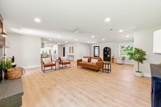 6713 Genoa Rd, Fort Worth, TX 76116 - living area featuring recessed lighting, light wood finished floors, a fireplace with raised hearth, baseboards, and ceiling fan