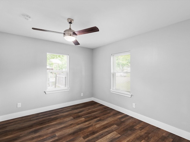 828 Ronald St, White Settlement, TX 76108 - unfurnished room featuring plenty of natural light, a smoke detector, baseboards, and dark wood-type flooring