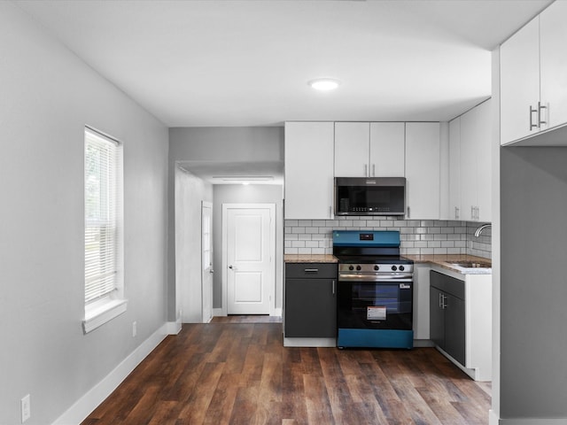 828 Ronald St, White Settlement, TX 76108 - kitchen with stainless steel electric range, a sink, decorative backsplash, and white cabinets