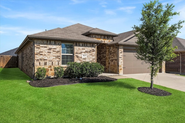 812 Draper Dr, Fate, TX 75189 - view of front of house with driveway, an attached garage, stone siding, and roof with shingles