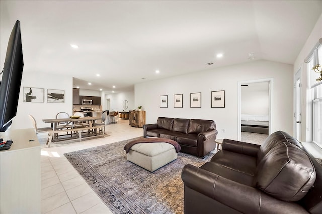 812 Draper Dr, Fate, TX 75189 - living room with light tile patterned floors, lofted ceiling, and recessed lighting