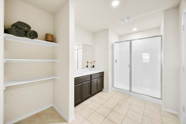 812 Draper Dr, Fate, TX 75189 - full bath with a stall shower, double vanity, recessed lighting, tile patterned flooring, and baseboards