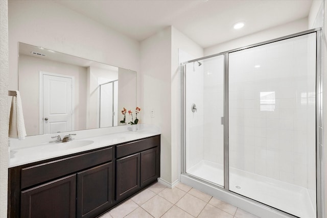 812 Draper Dr, Fate, TX 75189 - bathroom featuring tile patterned floors, a shower stall, and double vanity