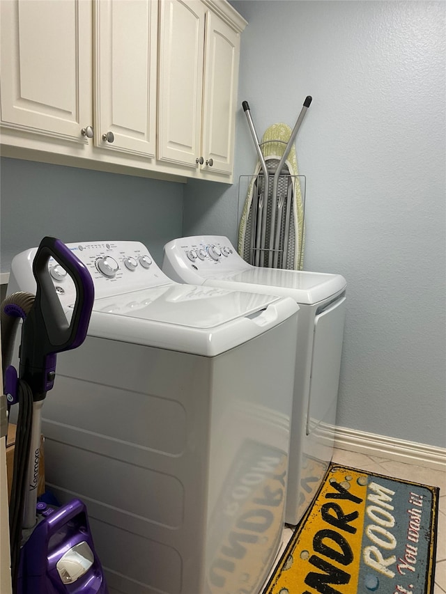 2916 Wilsonwood Way S, Sherman, TX 75092 - laundry room with washing machine and clothes dryer, cabinet space, tile patterned floors, and baseboards