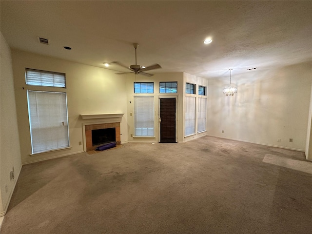 9706-9708 Springtree, Dallas, TX 75243 - unfurnished living room featuring a tiled fireplace, a chandelier, carpet, baseboards, and plenty of natural light