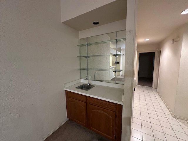 9706-9708 Springtree, Dallas, TX 75243 - indoor wet bar featuring baseboards and light tile patterned floors