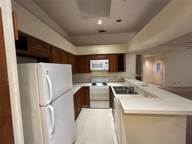 9706-9708 Springtree, Dallas, TX 75243 - kitchen with white appliances, a sink, a peninsula, light flooring, and light countertops