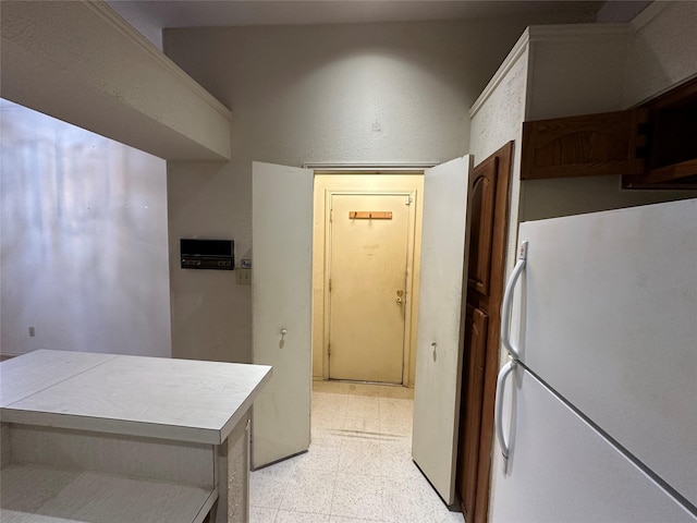 9706-9708 Springtree, Dallas, TX 75243 - kitchen with freestanding refrigerator, light countertops, and light flooring