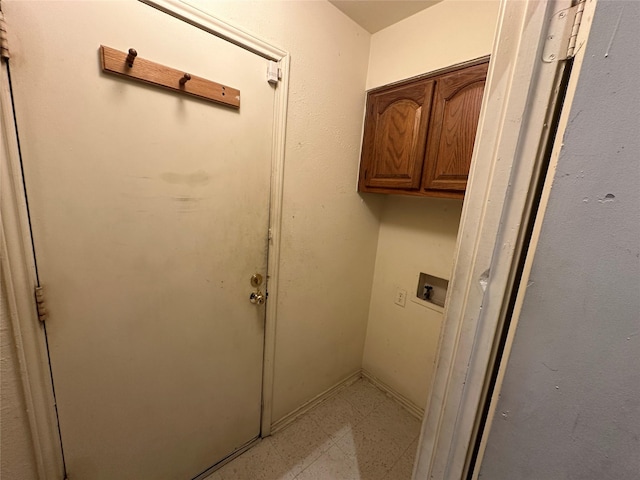 9706-9708 Springtree, Dallas, TX 75243 - laundry room with cabinet space, light flooring, and washer hookup