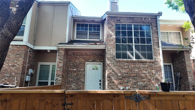 2405 Northlake Ct, Irving, TX 75038 - townhome / multi-family property featuring brick siding and a chimney