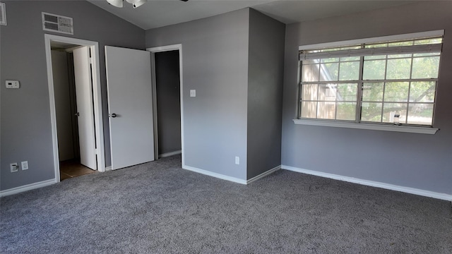 2405 Northlake Ct, Irving, TX 75038 - unfurnished bedroom with carpet, baseboards, and lofted ceiling