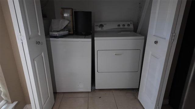 2405 Northlake Ct, Irving, TX 75038 - washroom with washing machine and dryer and light tile patterned floors