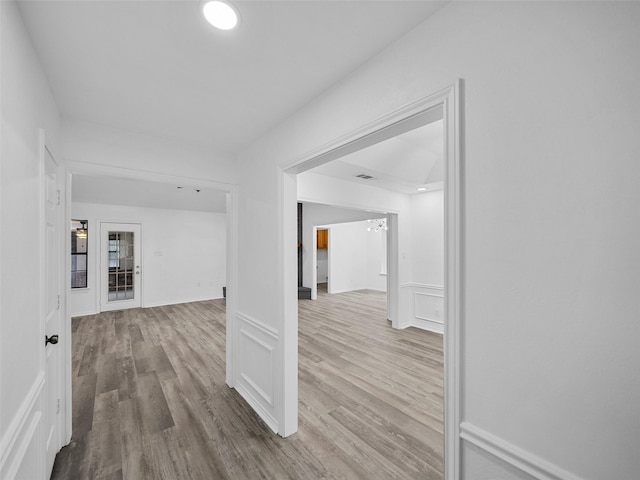 2219 N Lake Trl, Denton, TX 76201 - hallway with wood finished floors and a chandelier