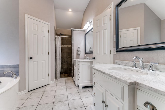 601 Natchez Ct, Hurst, TX 76054 - full bath featuring a tile shower, two vanities, a garden tub, marble look tile flooring, and lofted ceiling