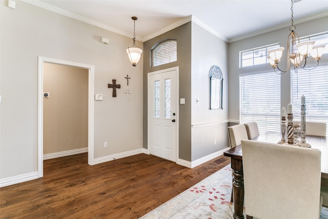 601 Natchez Ct, Hurst, TX 76054 - foyer entrance with a chandelier, crown molding, dark wood-type flooring, and baseboards