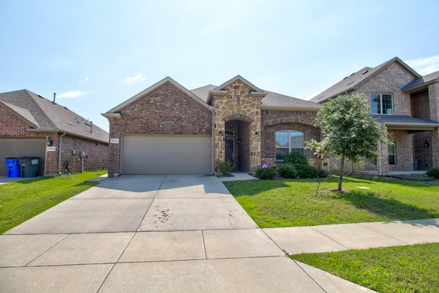 3713 Blessington Dr, Frisco, TX 75036 - french provincial home featuring a garage, a front lawn, driveway, brick siding, and stone siding
