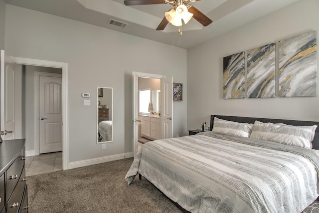 3713 Blessington Dr, Frisco, TX 75036 - bedroom with light carpet, baseboards, light tile patterned floors, connected bathroom, and ceiling fan