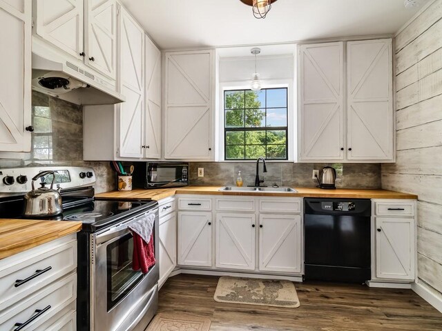 1501 N Business 45, Corsicana, TX 75110 - kitchen featuring wood counters, black appliances, a sink, under cabinet range hood, and white cabinetry
