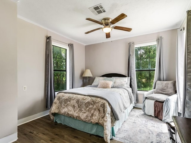 1501 N Business 45, Corsicana, TX 75110 - bedroom featuring wood finished floors, crown molding, baseboards, and a ceiling fan