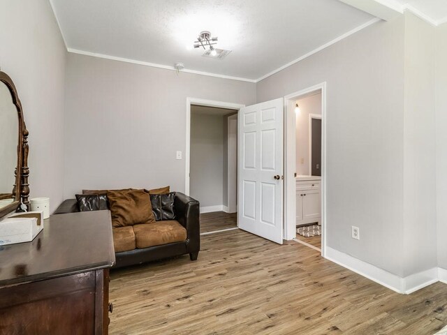 1501 N Business 45, Corsicana, TX 75110 - living room with light wood-type flooring, ornamental molding, and baseboards