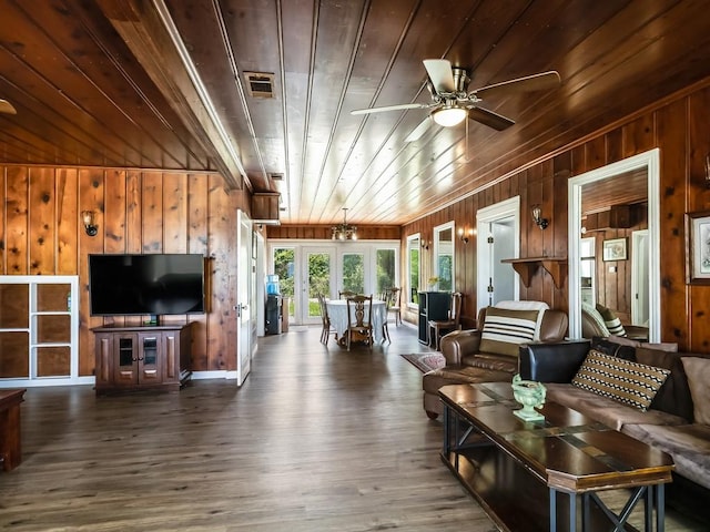 1501 N Business 45, Corsicana, TX 75110 - living room with wood walls, a ceiling fan, french doors, wooden ceiling, and wood finished floors