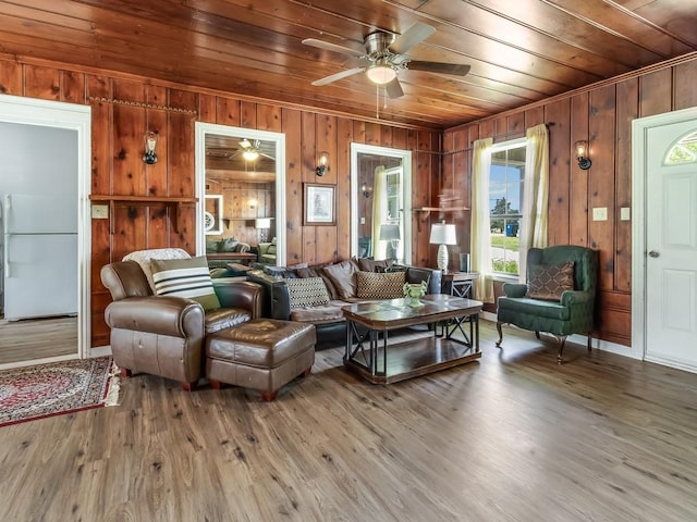 1501 N Business 45, Corsicana, TX 75110 - living room with wooden walls, ceiling fan, wood finished floors, and wood ceiling