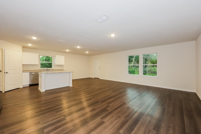 336 Bounding Main St, Gun Barrel City, TX 75156 - unfurnished living room with recessed lighting, dark wood finished floors, baseboards, and a sink
