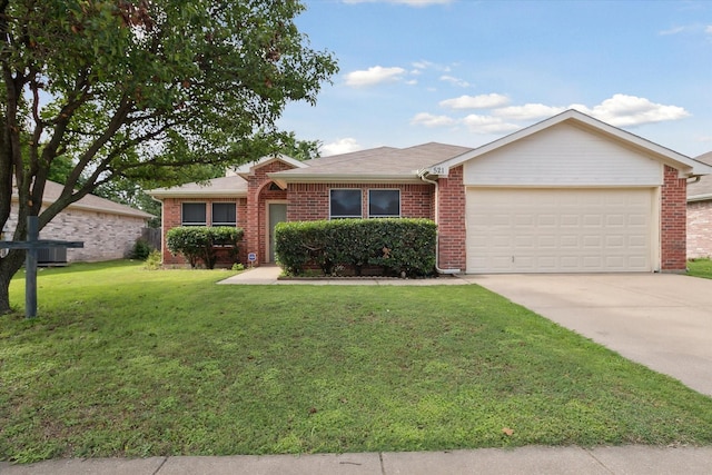 521 Ryan St, Saginaw, TX 76179 - ranch-style home featuring an attached garage, brick siding, driveway, and a front lawn