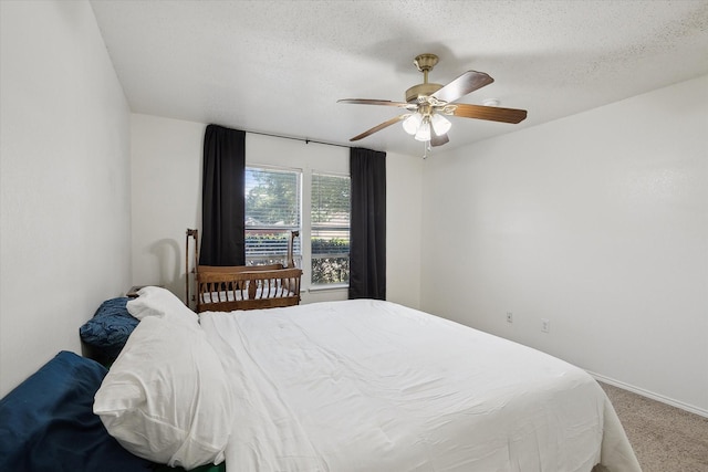 521 Ryan St, Saginaw, TX 76179 - bedroom with carpet flooring, ceiling fan, a textured ceiling, and baseboards