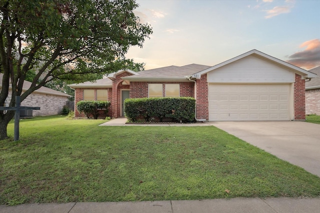 521 Ryan St, Saginaw, TX 76179 - single story home featuring an attached garage, driveway, brick siding, and a front yard