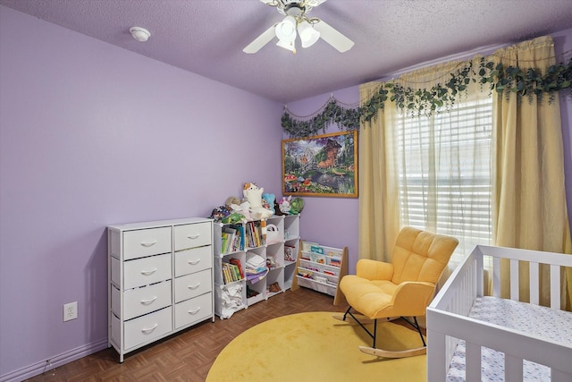 521 Ryan St, Saginaw, TX 76179 - bedroom featuring a textured ceiling, baseboards, and ceiling fan