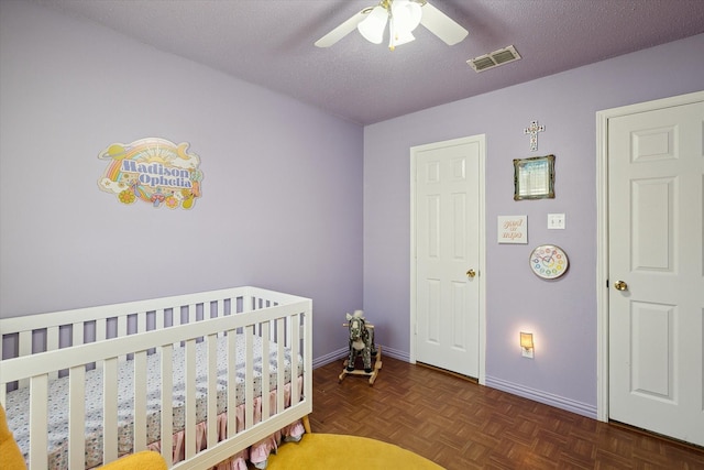 521 Ryan St, Saginaw, TX 76179 - bedroom featuring a nursery area, baseboards, and a ceiling fan
