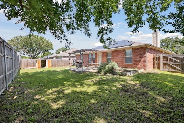 521 Ryan St, Saginaw, TX 76179 - rear view of property featuring brick siding, solar panels, a chimney, a patio, and a pergola