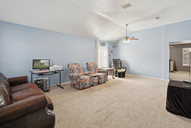 521 Ryan St, Saginaw, TX 76179 - carpeted living room featuring lofted ceiling, ceiling fan, baseboards, a textured ceiling, and plenty of natural light
