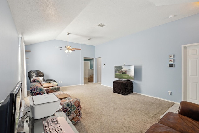 521 Ryan St, Saginaw, TX 76179 - carpeted living room featuring a ceiling fan, lofted ceiling, a textured ceiling, and baseboards