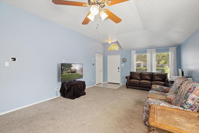 521 Ryan St, Saginaw, TX 76179 - living room featuring carpet flooring, lofted ceiling, ceiling fan, baseboards, and a textured ceiling