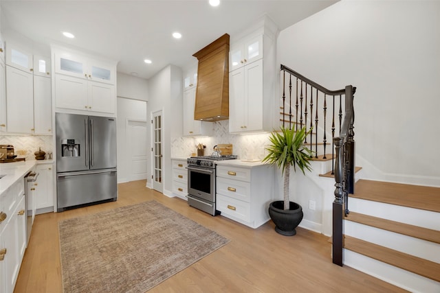 6501 Glenhope Cir S, Colleyville, TX 76034 - kitchen with stainless steel appliances, decorative backsplash, light countertops, white cabinetry, and recessed lighting