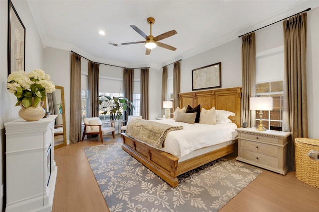 6501 Glenhope Cir S, Colleyville, TX 76034 - bedroom with crown molding, light wood-style floors, ceiling fan, and recessed lighting
