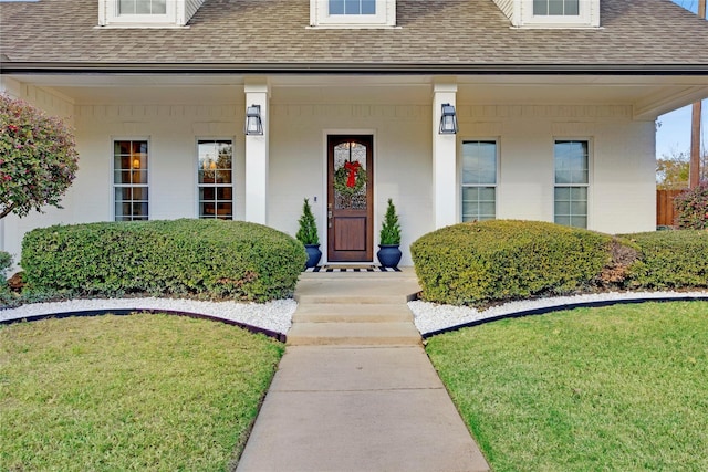 6501 Glenhope Cir S, Colleyville, TX 76034 - view of exterior entry featuring roof with shingles and a yard