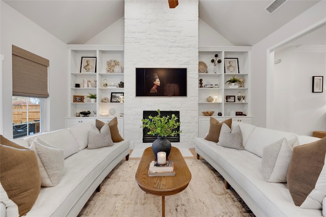 6501 Glenhope Cir S, Colleyville, TX 76034 - living area with lofted ceiling, a stone fireplace, and built in features