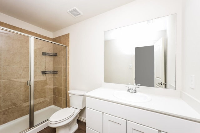 819 S Sutton St, Mabank, TX 75147 - bathroom featuring vanity, toilet, and a stall shower