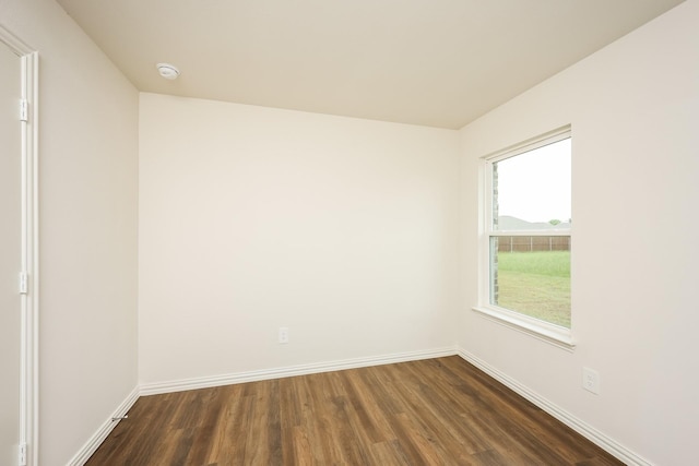 819 S Sutton St, Mabank, TX 75147 - empty room featuring dark wood finished floors, baseboards, and a smoke detector